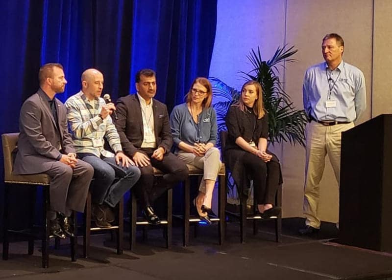 group of people sitting on stage