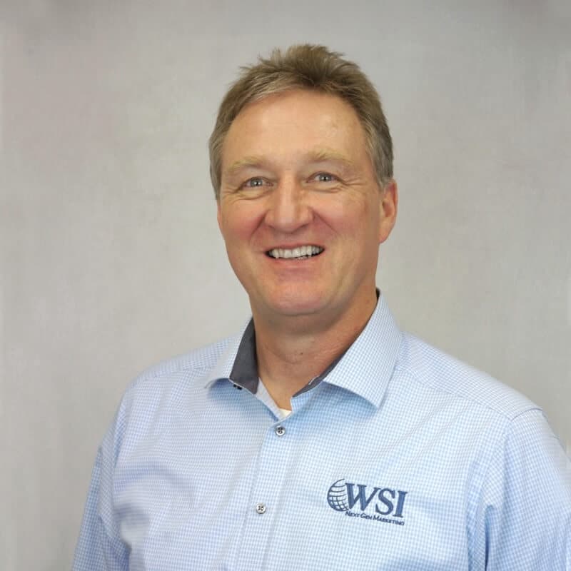 andreas smiling wearing wsi shirt