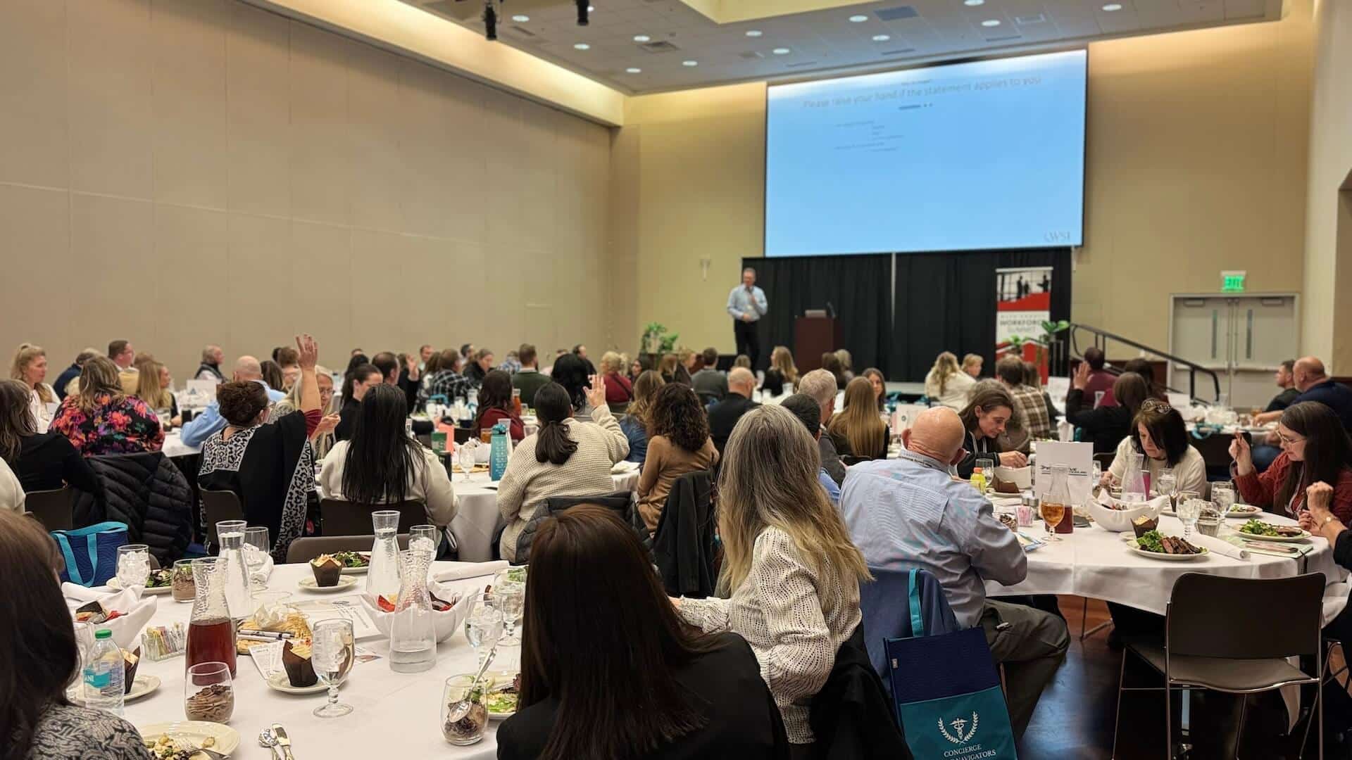 andreas speaking in front of large audience
