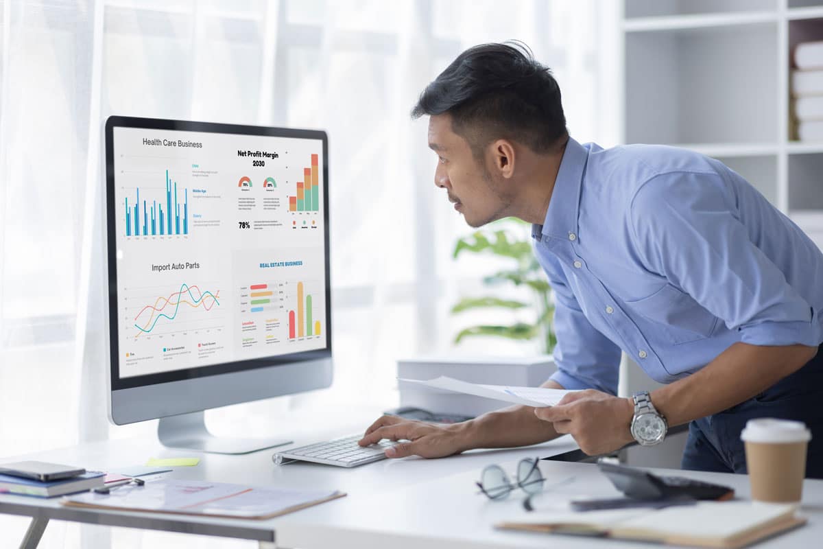 business man looking at modern marketing dashboard with AI-powered analytics