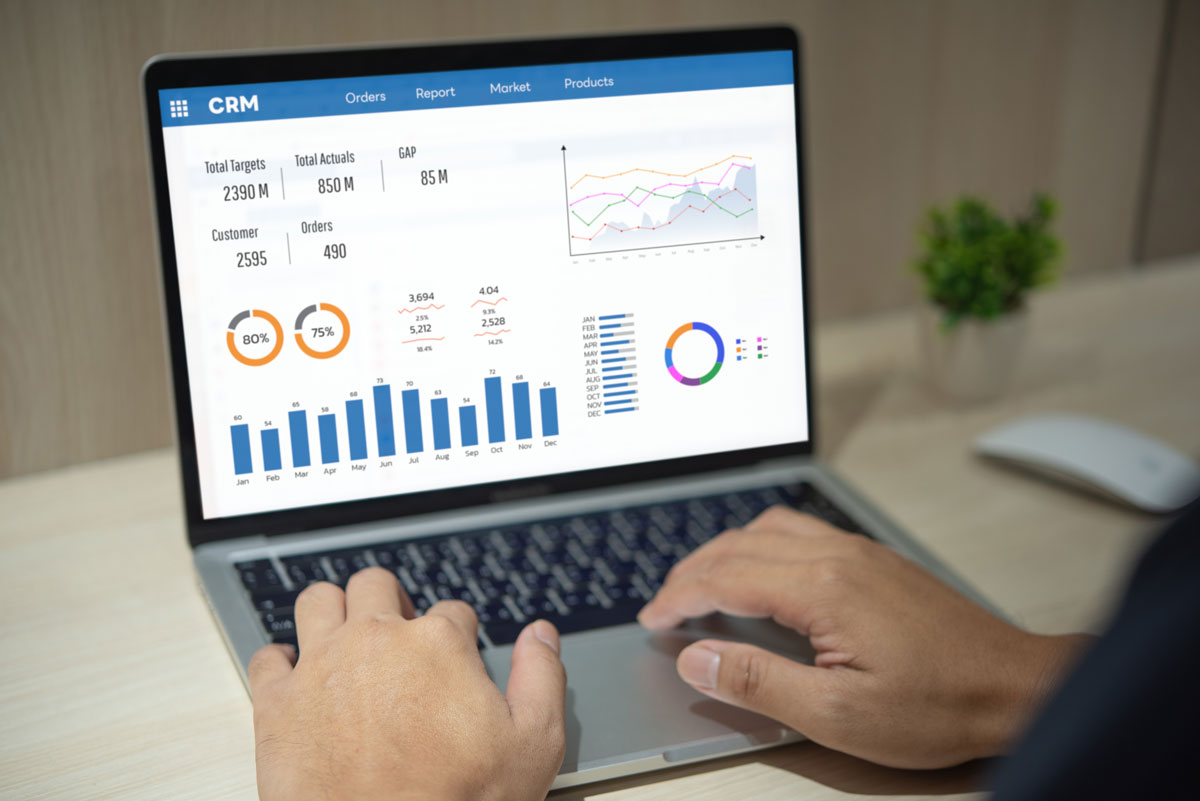 someone on laptop look at ads data in a CRM 